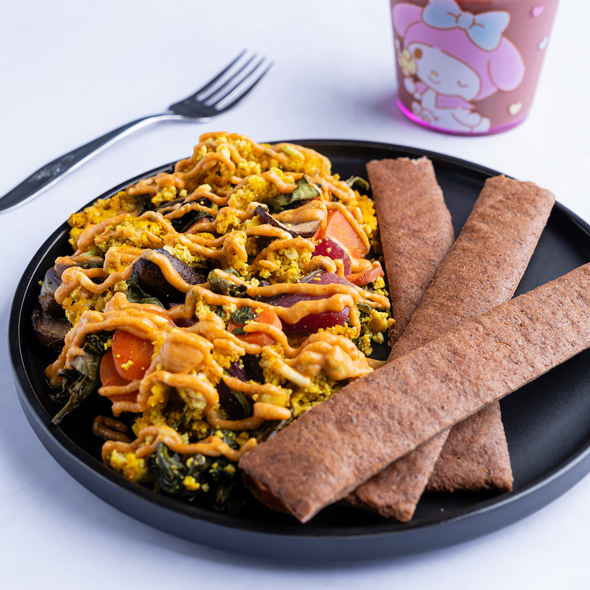 adzuki bean bacon on a plate with tofu scramble