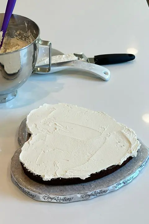 Assembling the vegan heart cake.