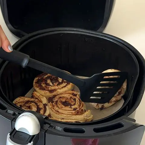 flipping the cinnamon rolls.
