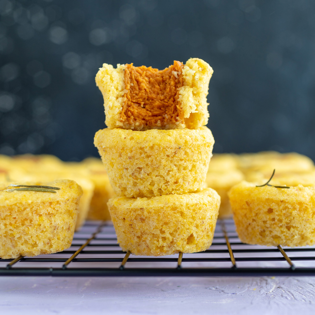 mini vegan corn dog nuggets, with a bite missing from one