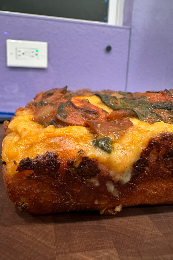 side view of the crust on the vegan detroit style pizza