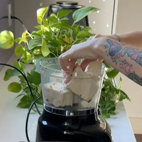 putting tofu into the food processor
