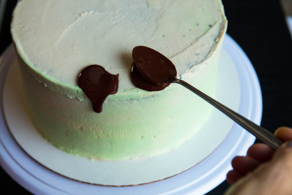 decorating cake with vegan ganache