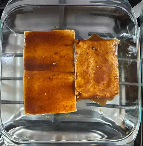 making fewer vegan ham slices in a brownie pan.