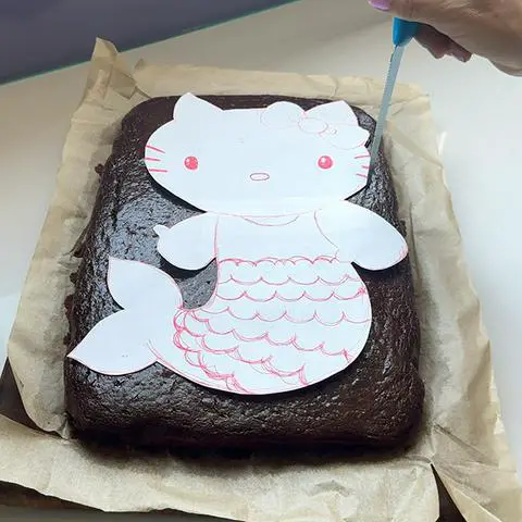 tracing around the hello kitty mermaid template with a skinny filet knife.