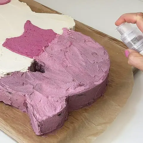 adding edible glitter to the mermaid tail.