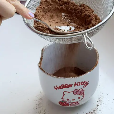 sifting the cocoa powder.