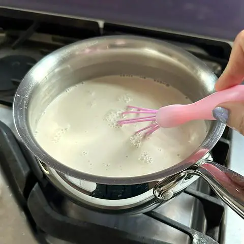 making vegan cookie dough ice cream in a saucepan on the stove.