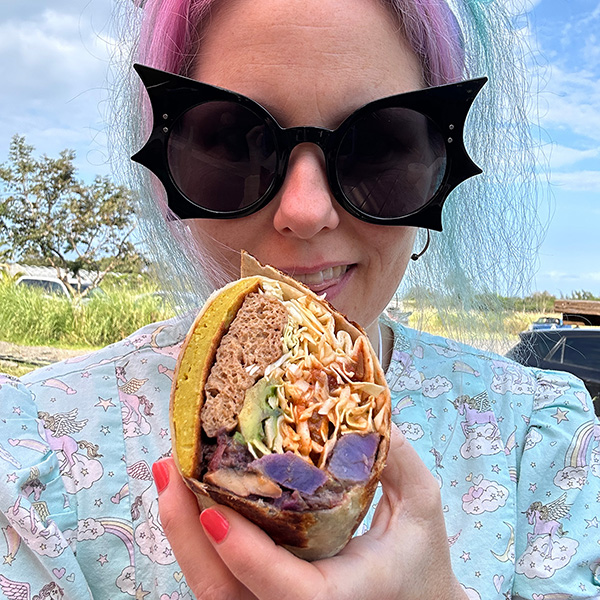 me holding half of a killer breakfast burrito from Rainbow Kitchen in Maui.