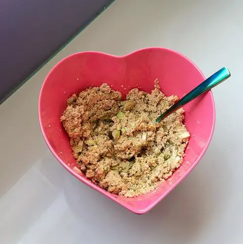 pink heart bowl filled with vegan tuna salad.