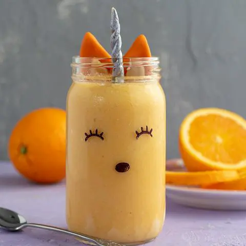 vegan orange julius decorated to look like a unicorn fox