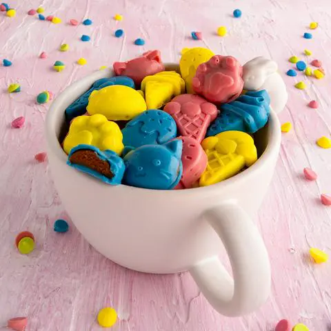 a white bowl with a bunny on it, filled with healthier peanut butter cups.