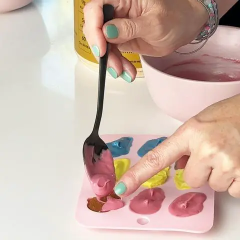 adding more chocolate on top of the peanut butter filling.