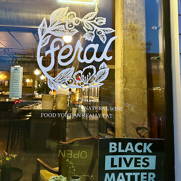 outside of a vegan bar called Feral in Portland.