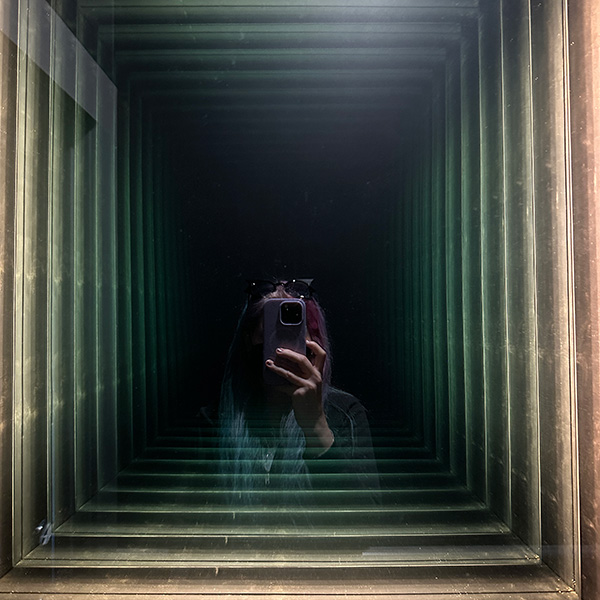 ghost mirror in the bathroom at the Uncanny in Portland.