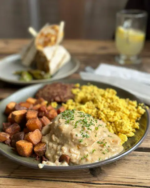 Victoria breakfast plate with the Humboldt burrito in the background from Victoria in Portland