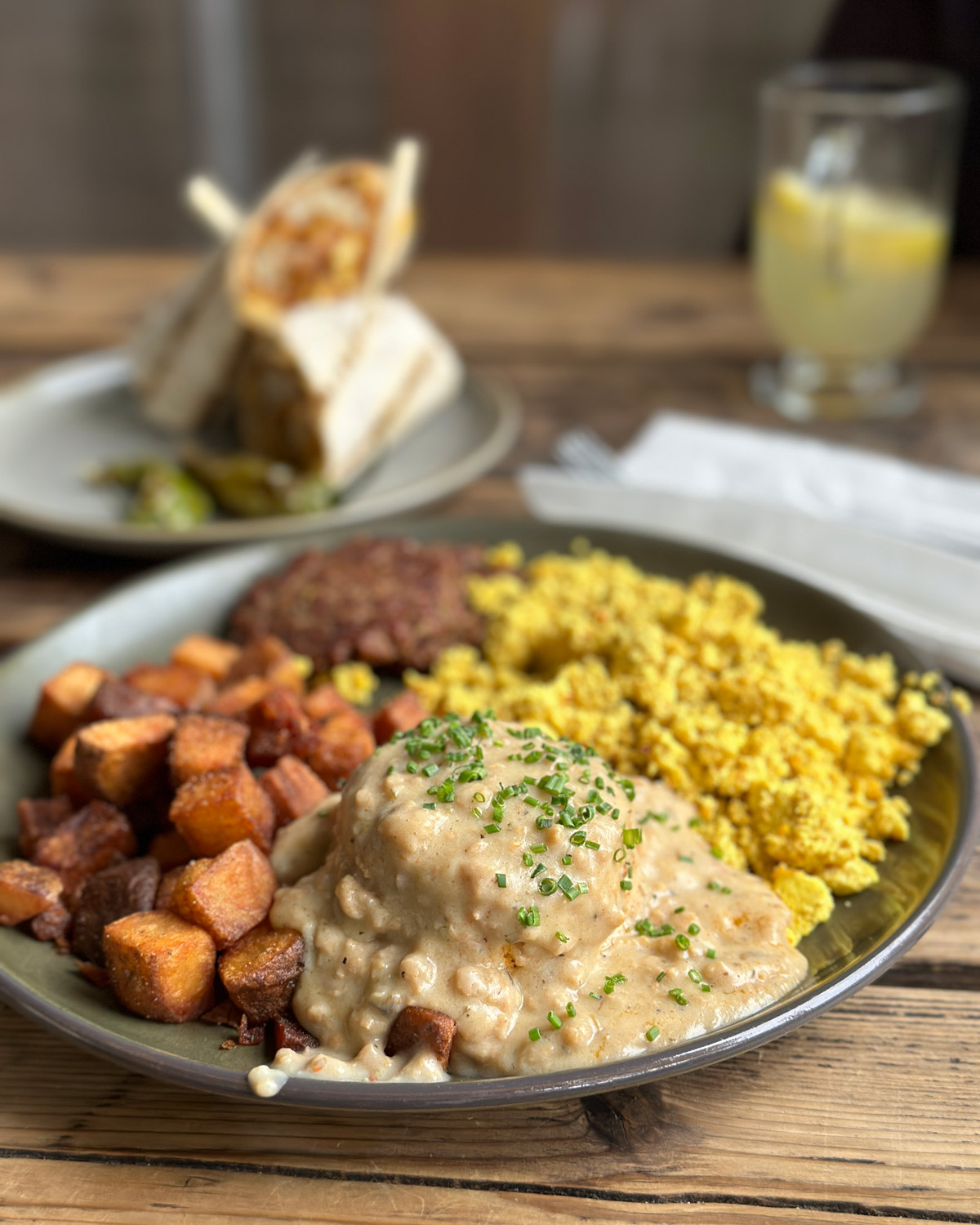 Victoria breakfast plate with the Humboldt burrito in the background from Victoria in Portland