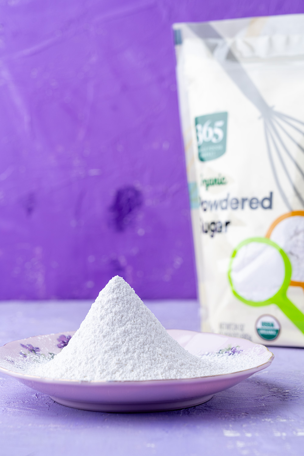 a saucer of sifted vegan powdered sugar