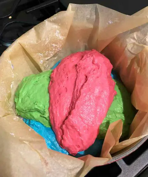 layering vegan rainbow bread dough