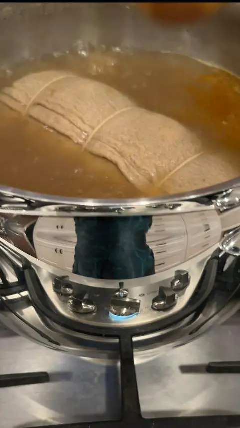 cooking a vegan roast on the stovetop.