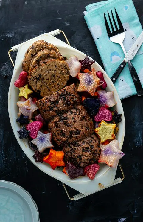 a sliced vegan roast, ready to serve.