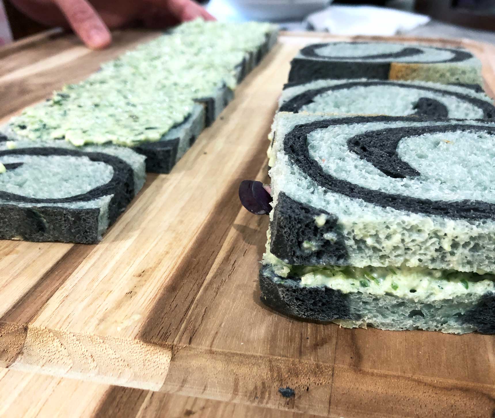 using the bread to make sandwiches for an alice in wonderland picnic