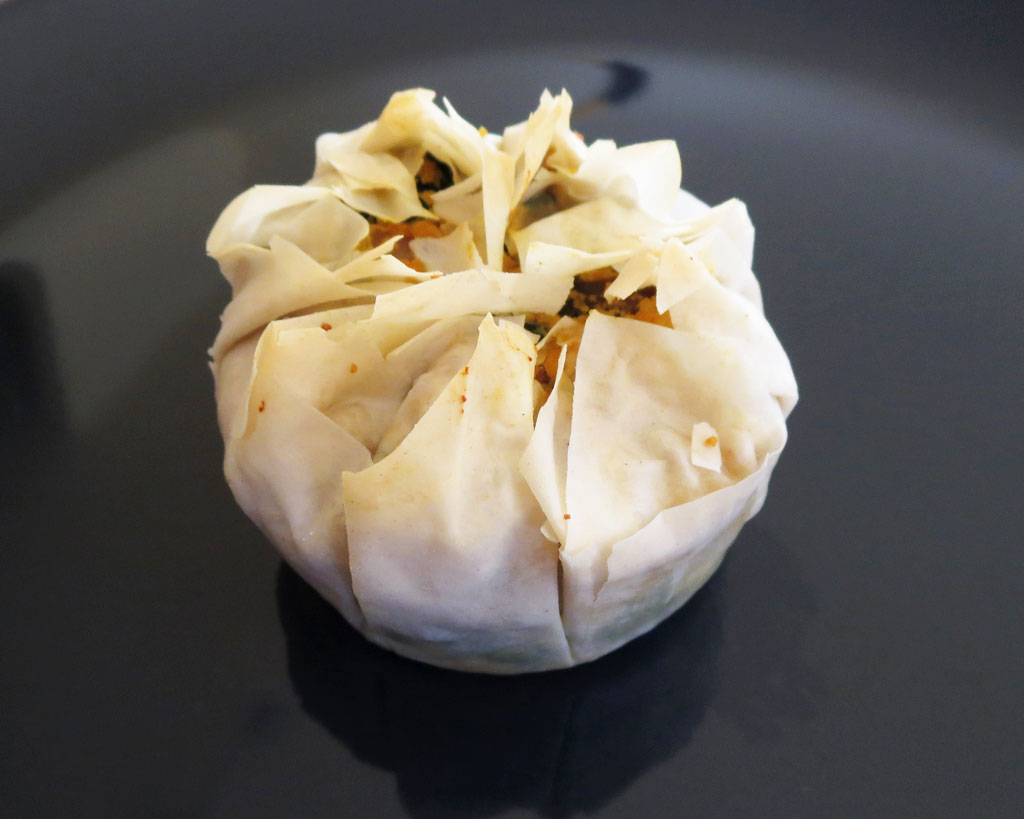 a tofu breakfast basket on a black background.