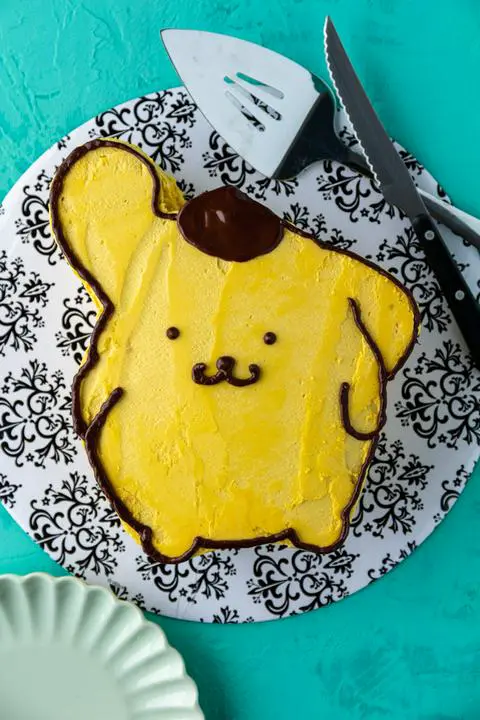 Vegan vanilla birthday cake decorated to look like Pompompurin
