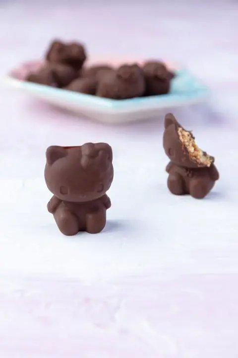vegan butterfinger hello kitty candy with a bite missing.